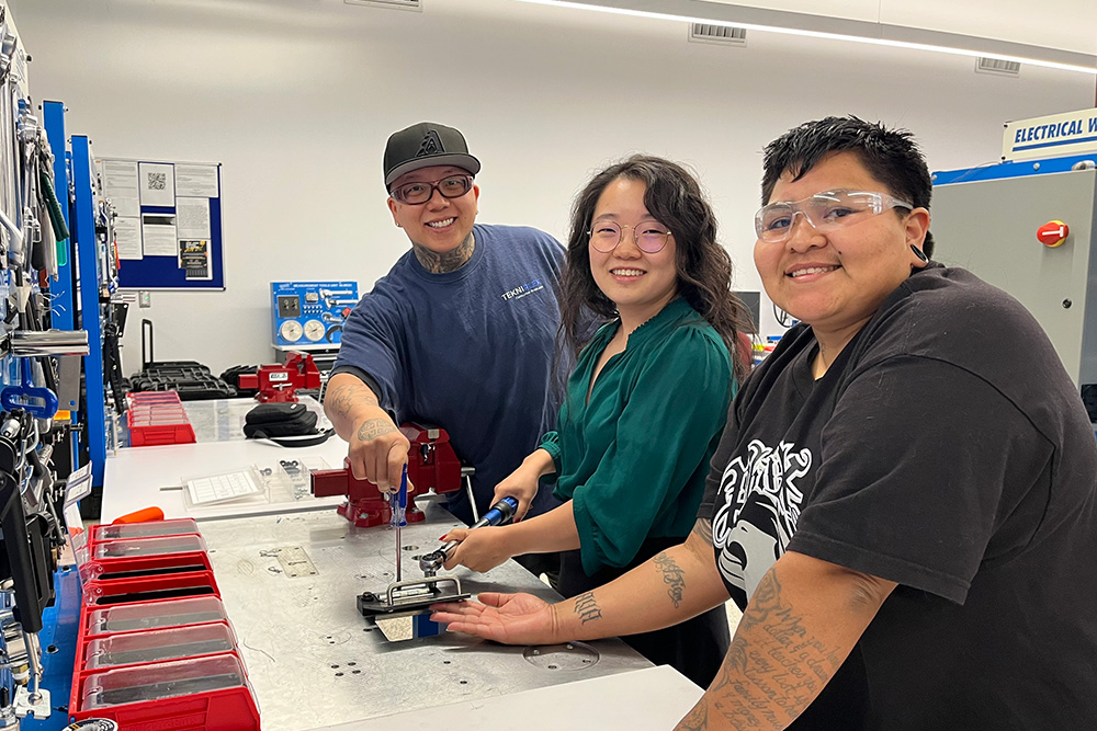Row of three students iin a technology lab