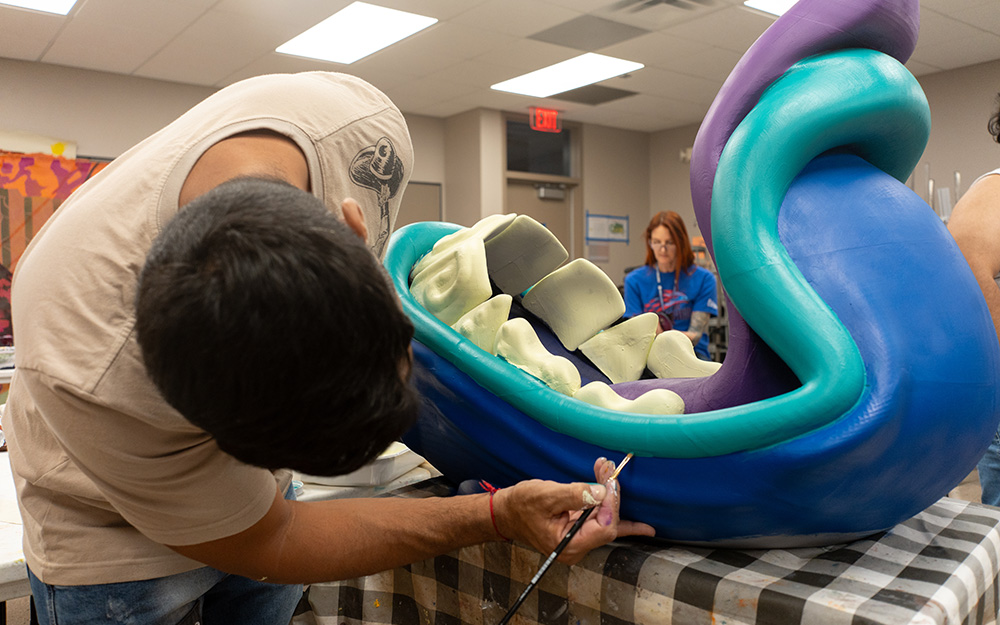 Student working on art exhibit